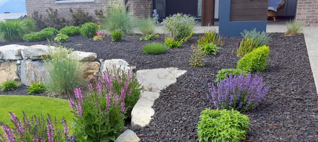 Budget-friendly yard transformation with native plants, decorative stones, and mulch in a Morris County garden